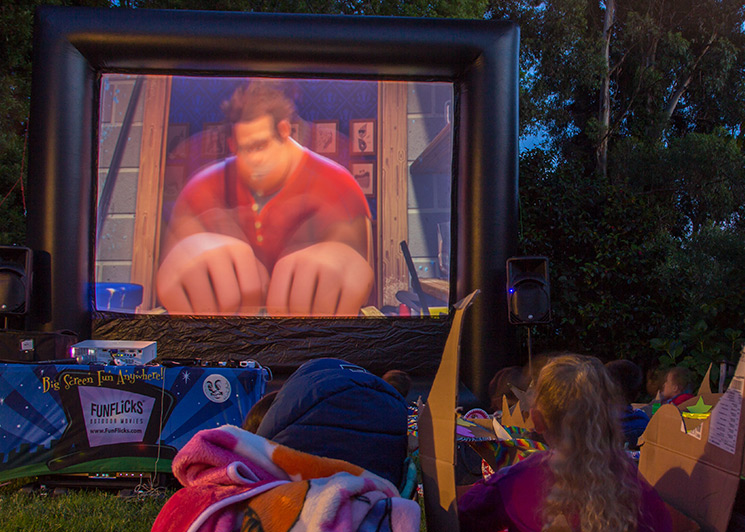 Backyard mini drive-in with a FunFlicks outdoor movie screen