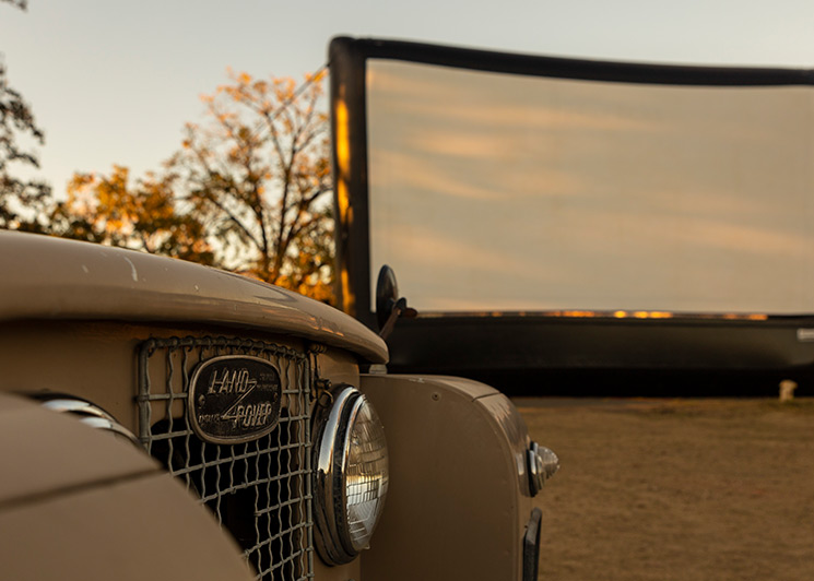 Classic car in front of a giant FunFlicks inflatable screen