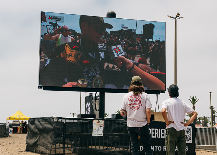 Fans watching XGAMES competition on a FunFlicks LED screen